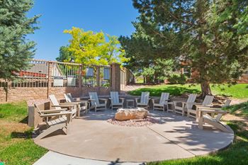 Courtyard pergola with grilling stations, fire pit, and seating areas